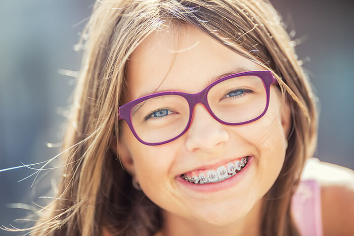 smiling girl with braces
