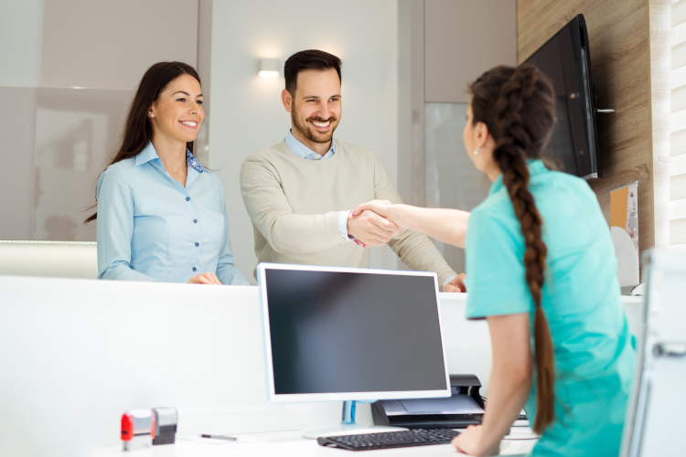 orthodontist showing treatment progress chart to patient