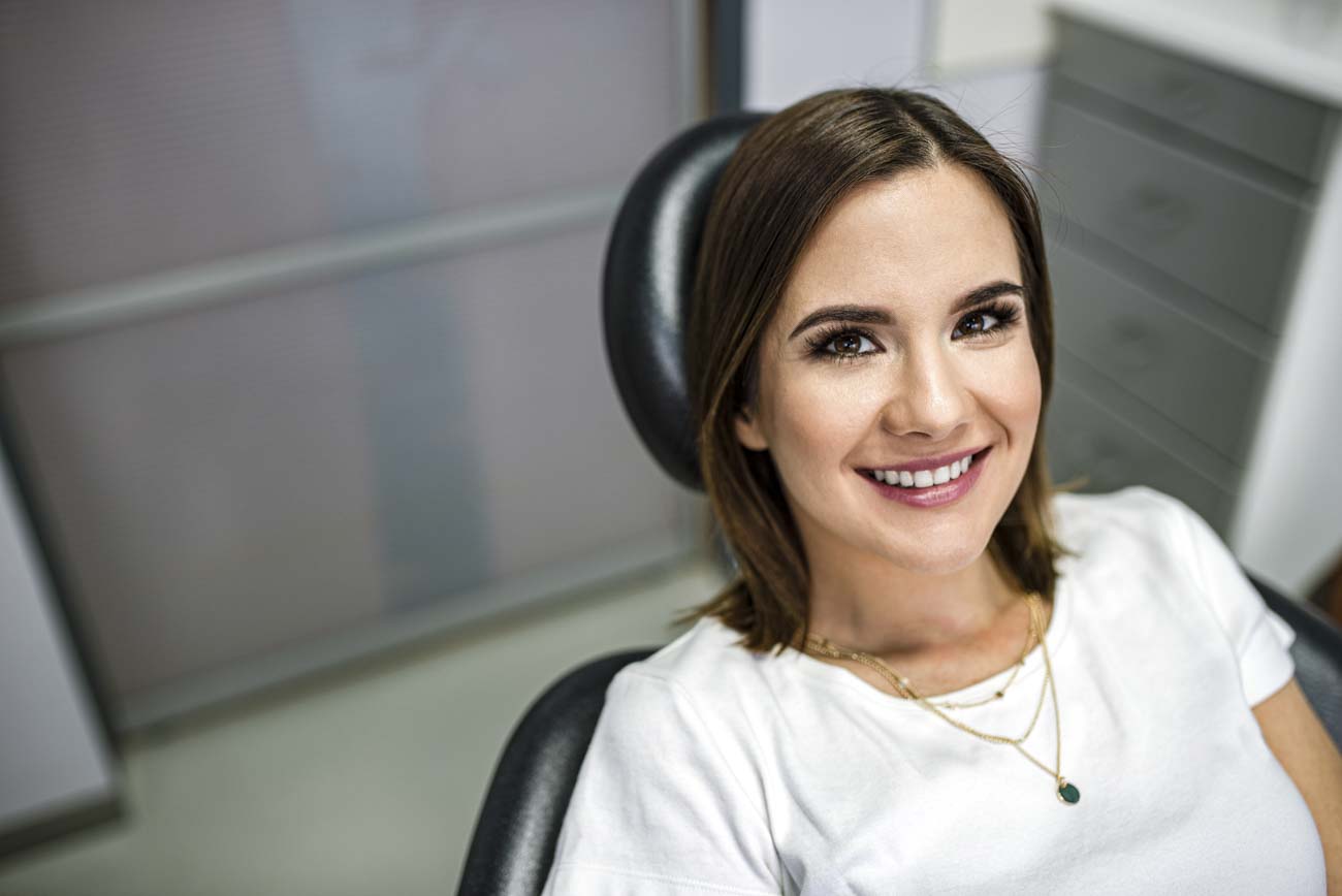 adult smiling after completing Portland dental braces