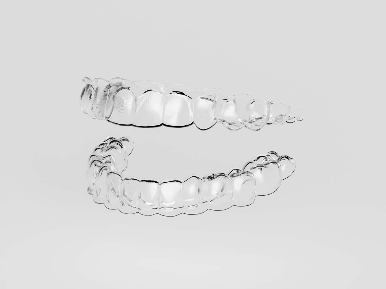 Portland clear aligners placed on a white tray